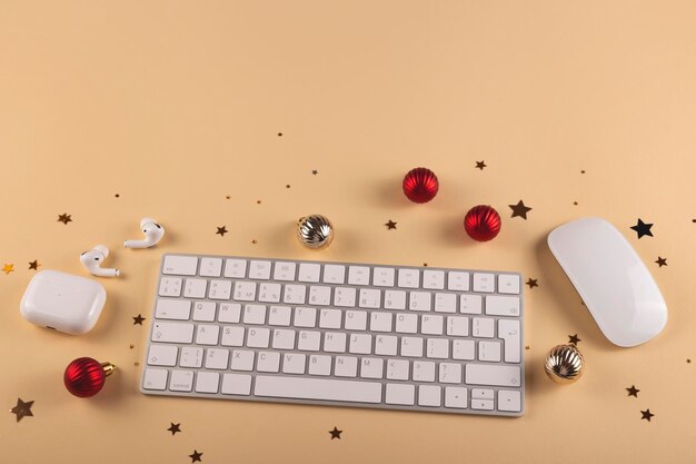 Christmas layout with decorations on workplace with keyboard