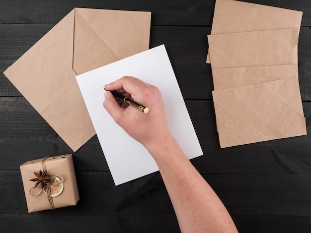 Christmas letter on a dark wooden background.