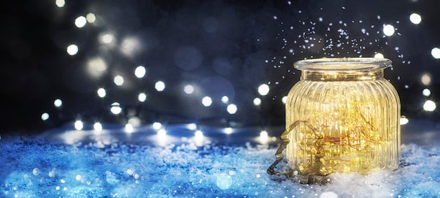 Christmas lighting in the jar, Christmas and New Year holidays background, winter season.