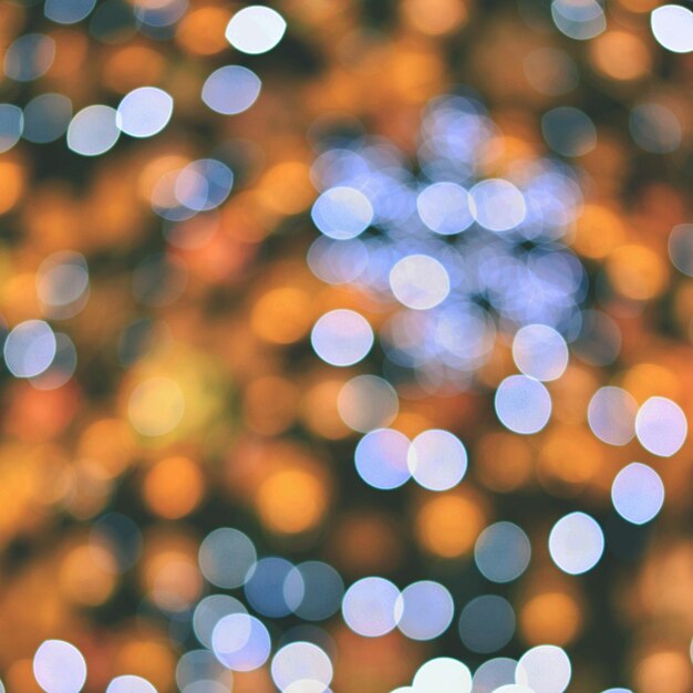 Luci di natale sfondo colorato astratto con decorazioni natalizie bokeh sfocato