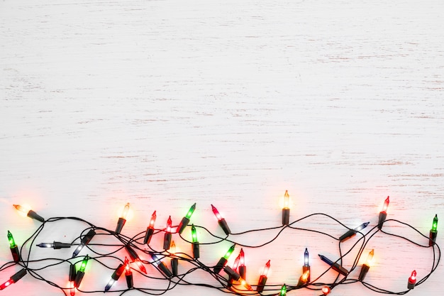 Christmas lights bulb decoration on white wood