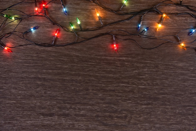 Christmas lights on dark wood
