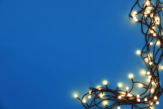 Christmas lights glowing on blue background