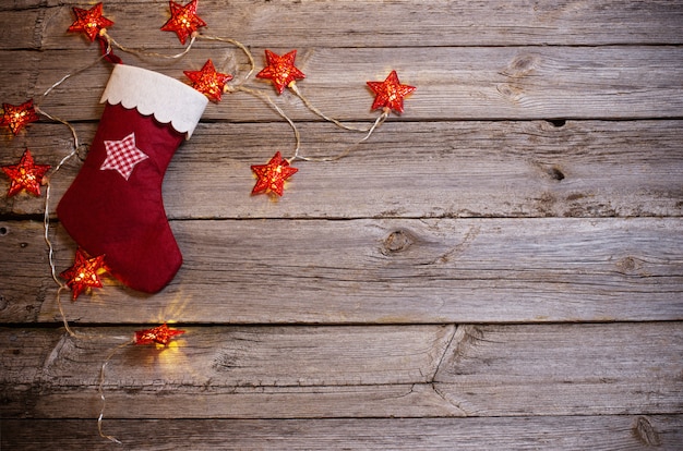 Christmas lights on wooden background