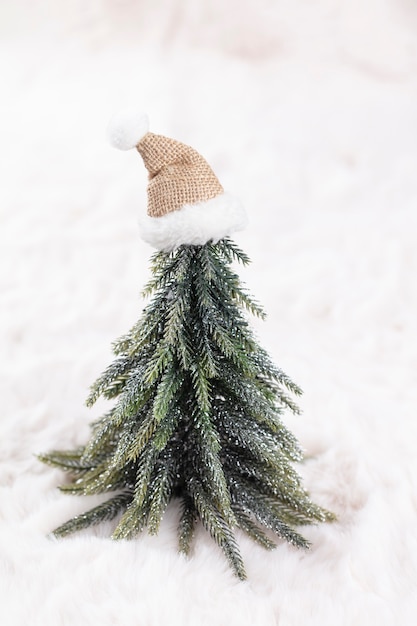 Christmas little trees and wool background.