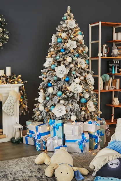 Christmas living room. Blue and white decor christmas tree background. New Year celebration. Merry Christmas and Happy New Year.