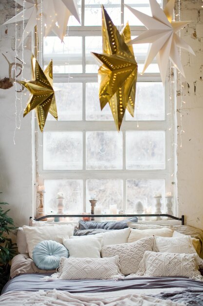 Christmas loft bedroom with big windows Christmas decorations Christmas trees and lights Loft boho interior with Christmas decor