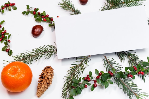 Christmas mockup for postcard with dry fruits, craft paper, gift box, handmade christmas toys