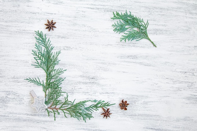 Photo christmas mockup with pine branches on white paper