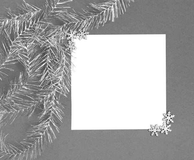 Photo christmas mockup with silver snowflakes on grey background. space for text.