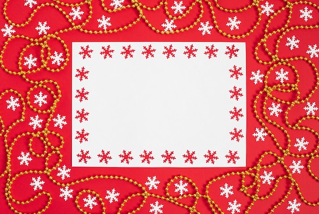 Photo christmas mockup with snowflakes and gold garland on red background.