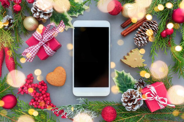 Christmas mosk up smart phone wish list on gray background decorations and bohen Merry Christmas