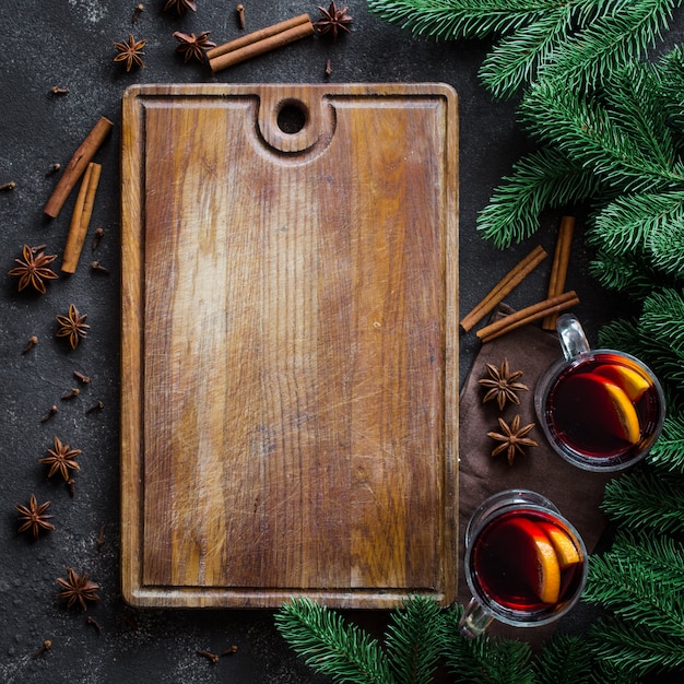 Christmas mulled red wine with spices on dark