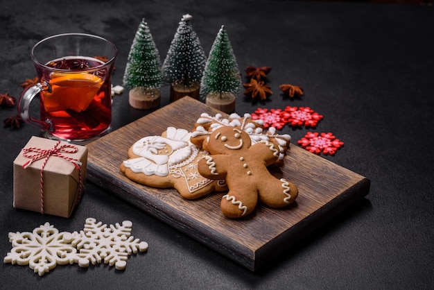 Christmas mulled red wine with spices and fruits on a concrete table