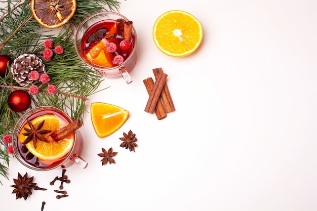 Christmas mulled wine and Christmas tree branches on a white background. Flat lay style