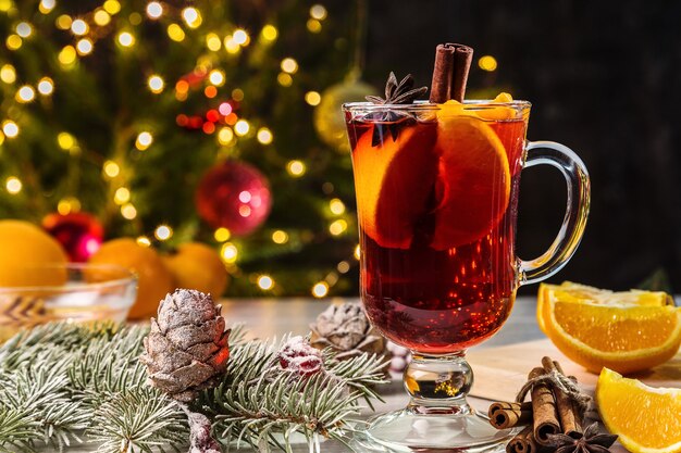 Christmas mulled wine, cinnamon and branches of spruce