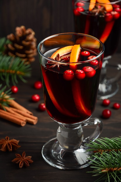 Christmas Mulled Wine with Orange and Cranberries. Holiday   Decorated with Fir Branches and Spices.