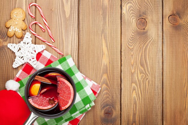 Christmas mulled wine on wooden table