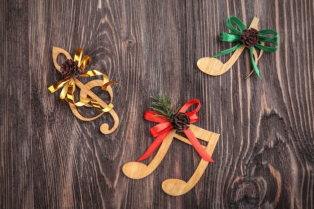 Christmas music concept. decorative clef and notes with bows on table