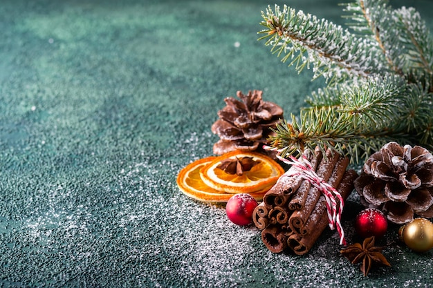 Christmas natural composition with cinnamon, pine cones and dry oranges.