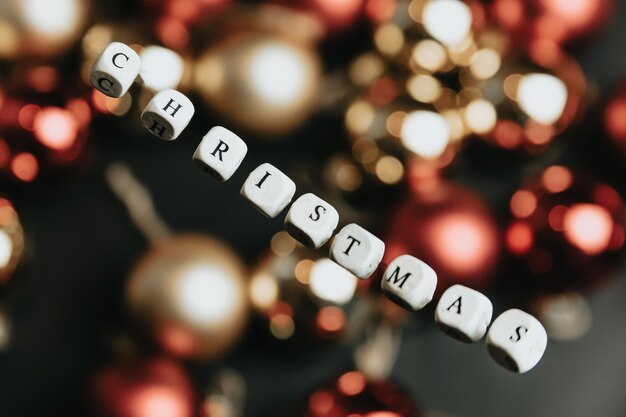 Photo christmas new year background mock up flat design, lettering merry christmas, floating word colorful brilliant background, copy space, happy day ,banner, gold red and black out of focus background