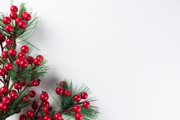 Christmas new year composition on white background. Fir branches, christmas decoration. Flat lay, top view, copy space.