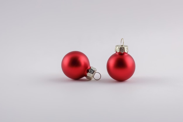 Christmas and New Year concept, two little red balls on background with free copy space