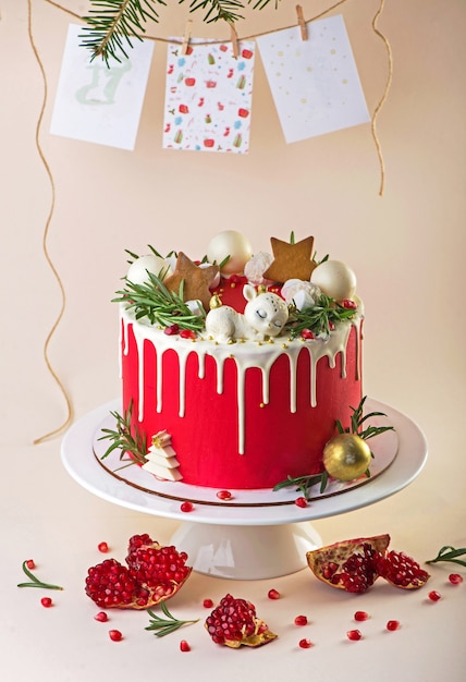 Christmas or New Year decorated cake with cream cheese frosting and cranberries, selective focus