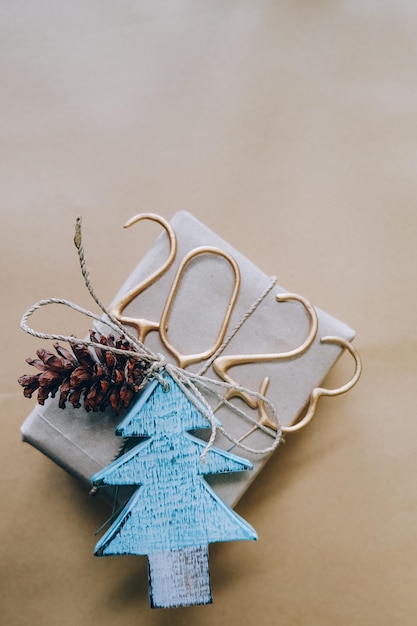 Christmas or new year decorated gift hand made box with pine\
and tree and new year numbers