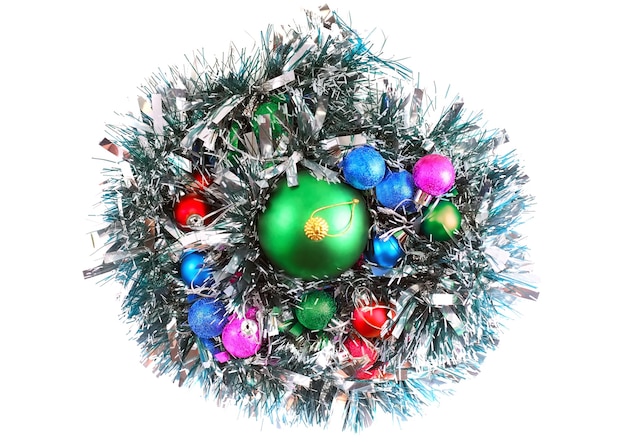 Christmas and New Year decoration- glass balls, green tinsel . Close-Up. On white background, isolated.