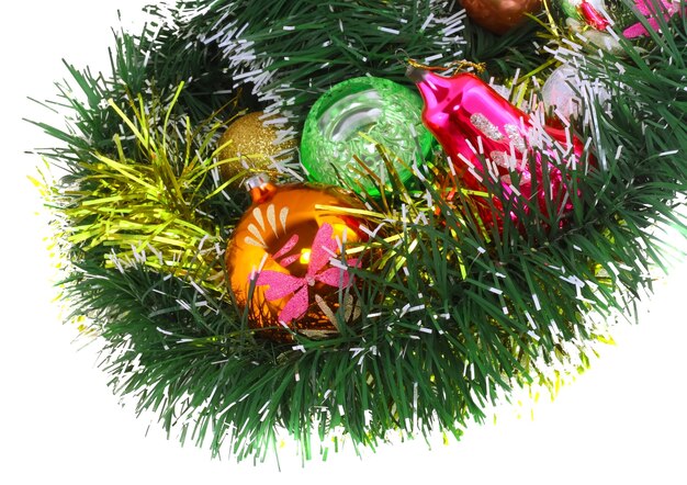 Christmas and New Year decoration- glass balls, green tinsel . Close-Up. On white background, isolated.