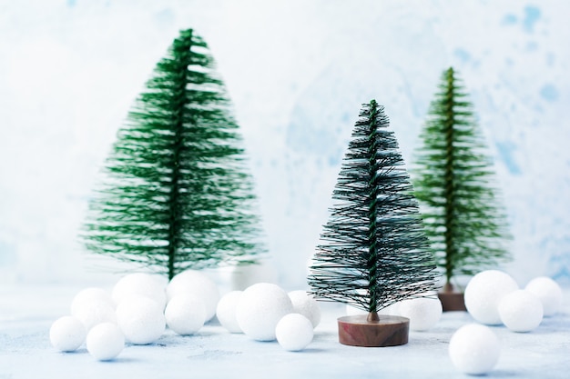 Christmas, New Year decoration, tree with snow on blue.  Selective focus.