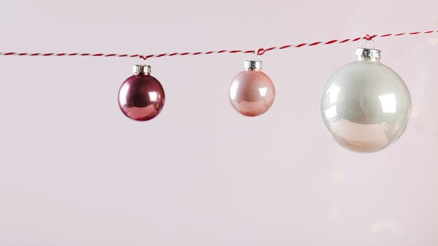 Christmas and new year gift card christmas balls on a red thread copy space