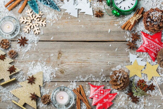 Christmas new year holiday concept Festive decoration for greeting card with christmas symbols tree clock star candles Flat lay top view copy space wooden background