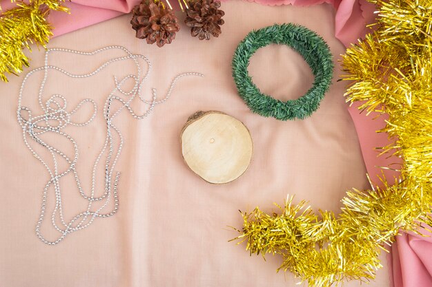 Christmas and New Year's Minimalist Concept. The composition displays the product. displaying products on wood with christmas and new year decorations