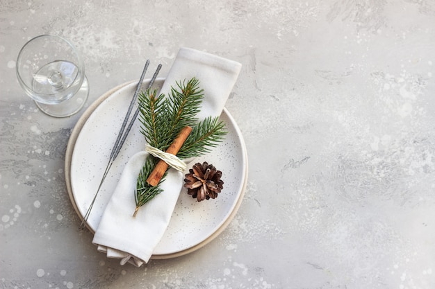 Christmas or New Year table setting with festive decorations.