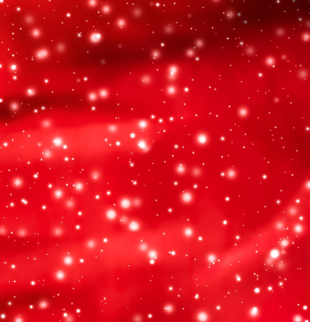 Foto natale capodanno e san valentino sfondo astratto rosso vacanze card design lucido neve glitter come sfondo di vendita stagione invernale per il marchio di bellezza di lusso