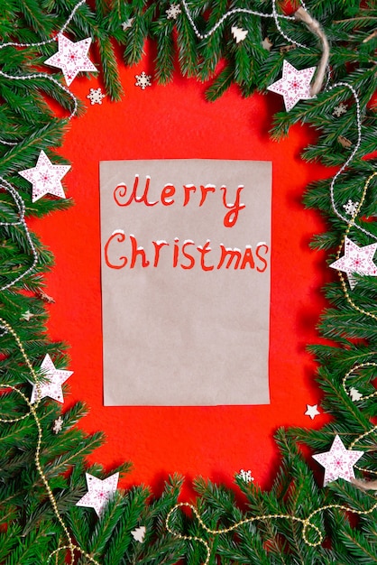 A Christmas note on a red Christmas background.