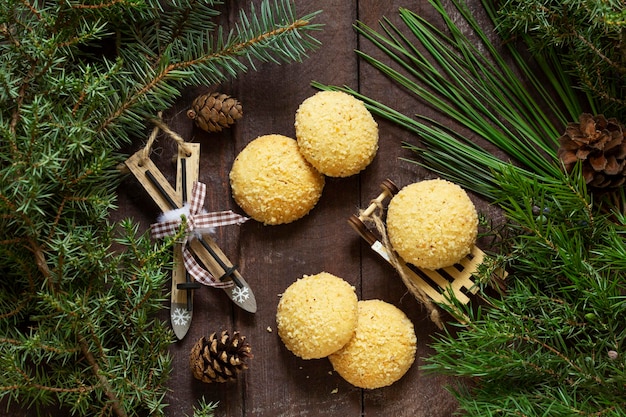 Christmas nut cookies filbertines on a background of branches cones and christmas decorations