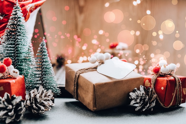 christmas online shopping, work and education. new year decorations on table. notebook computer at home. winter holidays sales. gift boxes, christmas trees. garland light