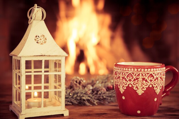 Christmas ornament near fireplace. Winter holiday concept