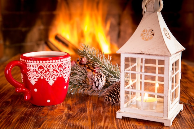 Christmas ornament near fireplace. Winter holiday concept