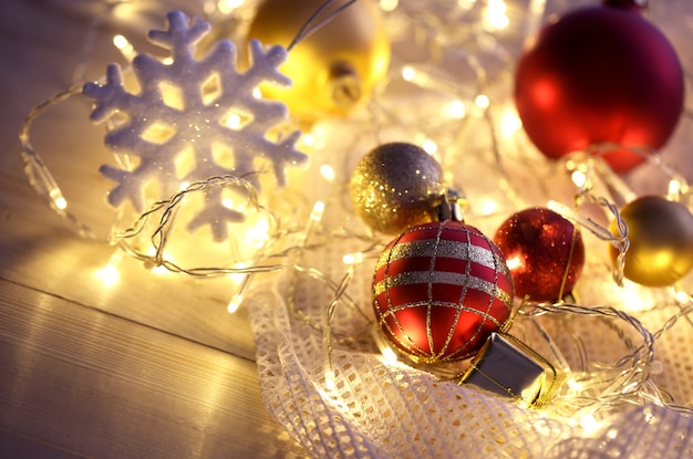 Christmas ornaments and garland on bright background close-up