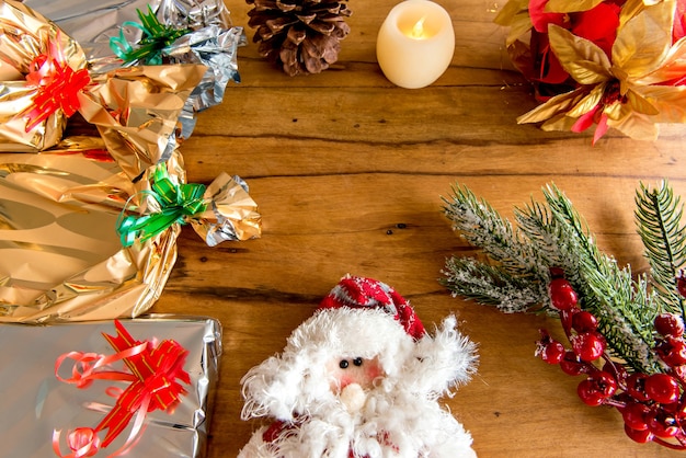 Christmas ornaments and gifts on wooden table