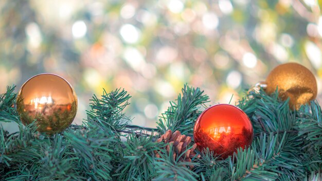 Christmas ornaments gold ball and red ball with blurred bokeh light