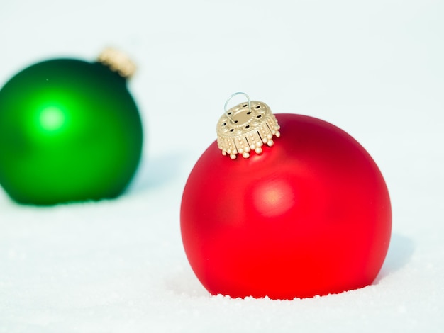 Christmas ornaments in virgin snow.