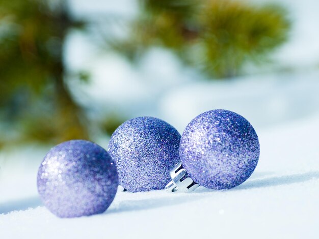 Christmas ornaments in virgin snow.