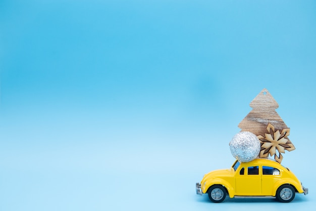 Christmas ornaments on a yellow car