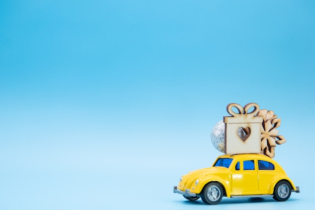 Christmas ornaments on a yellow car