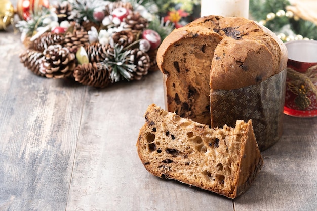 Christmas panettone cake with chocolate chips on wooden table